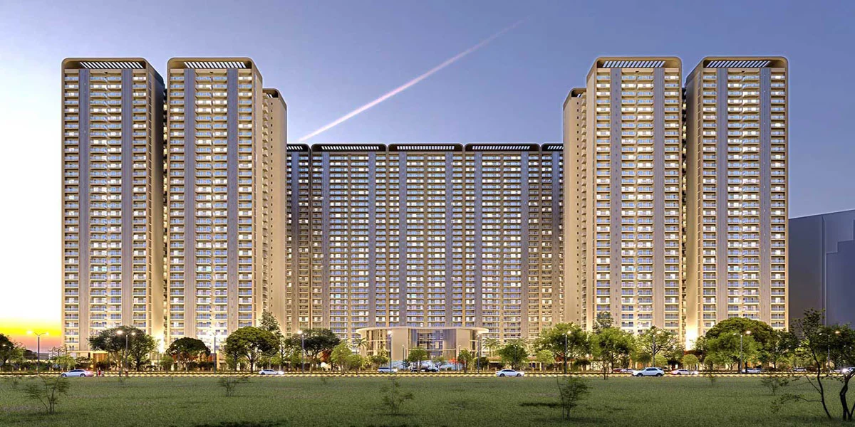 Forbes Fab Luxe Residences front elevation at dusk showing all towers with warm golden lighting